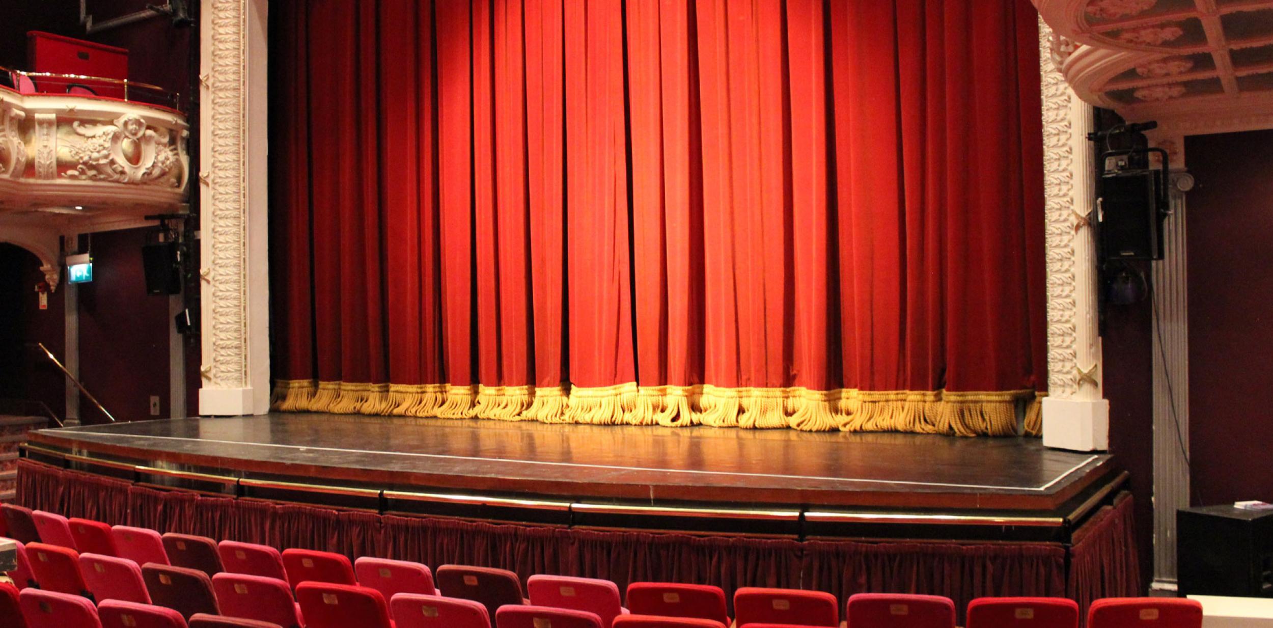 Inside the theatre auditorium facing the stage