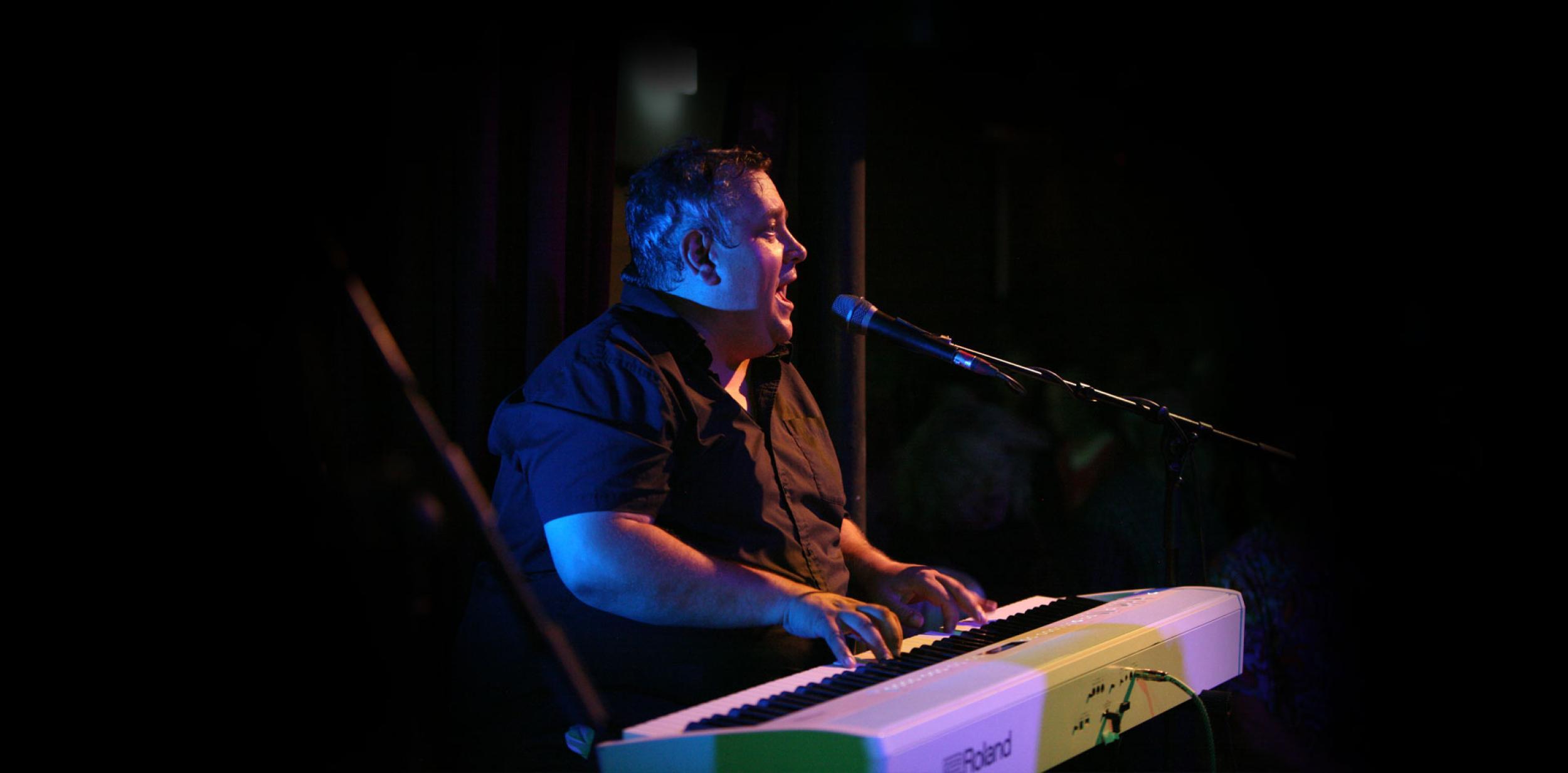 A person playing an electric keyboard