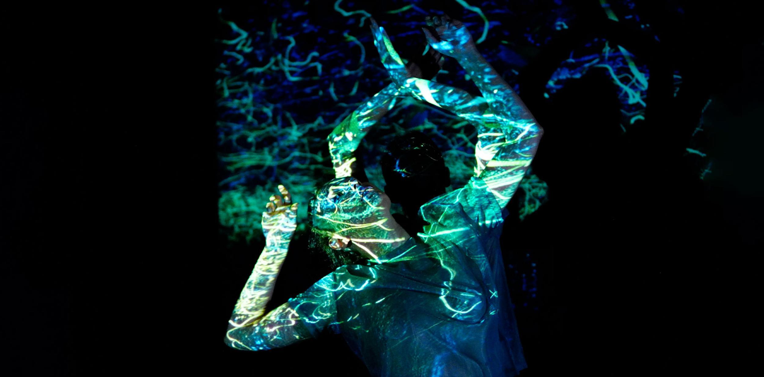 Contemporary dancer and light projection