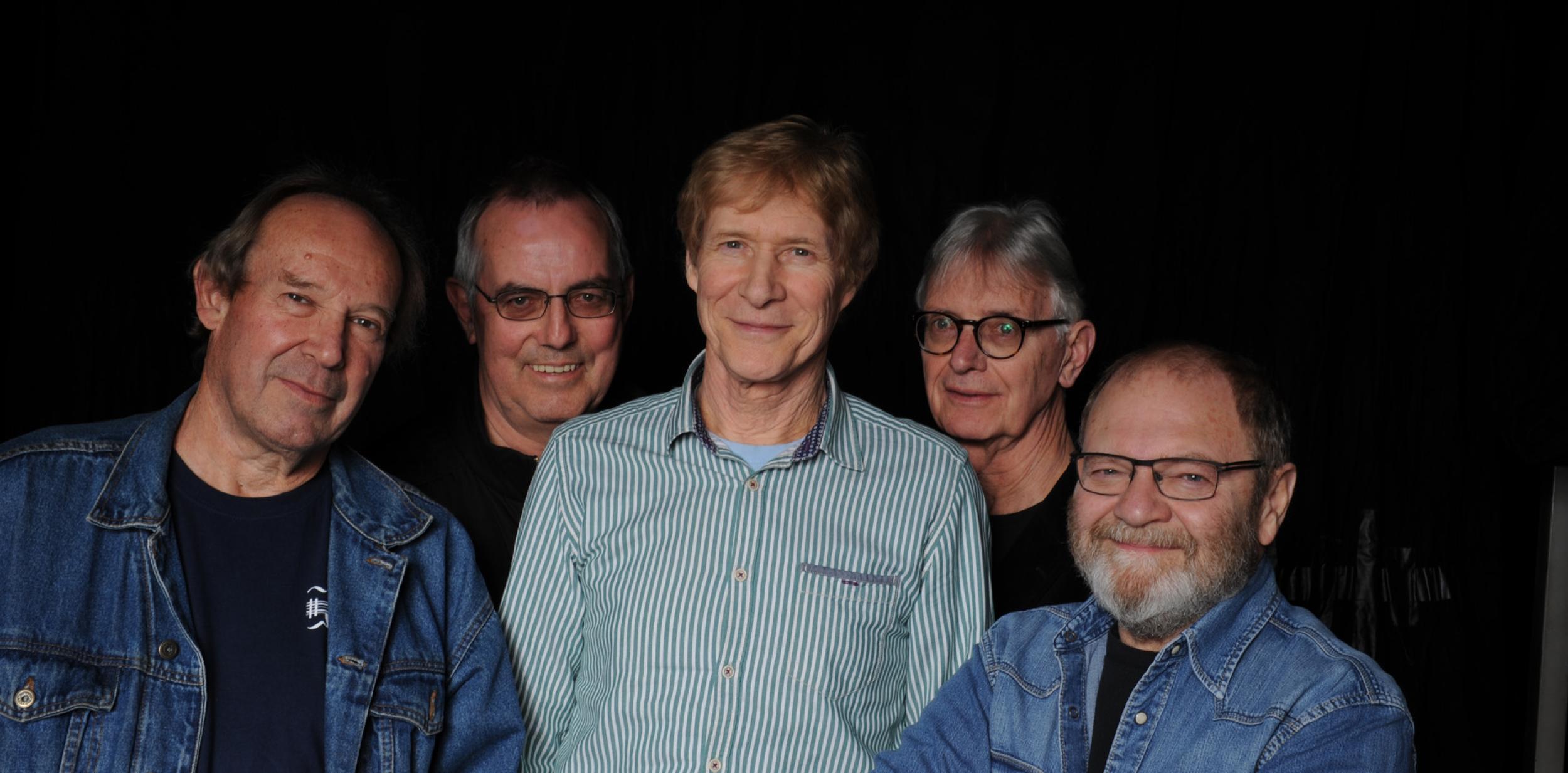 Picture of the Blues Band in front of a black background