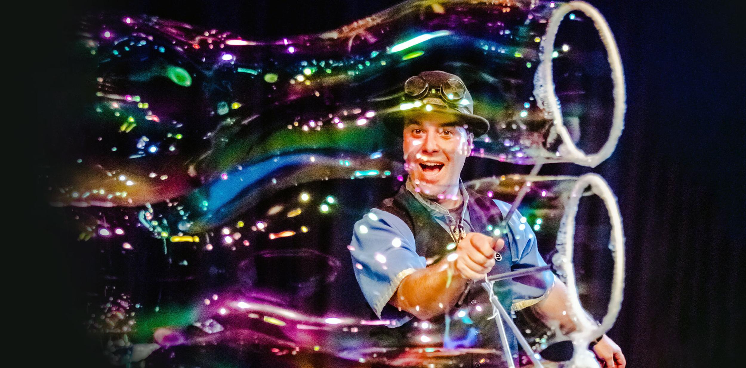 A person making giant bubbles