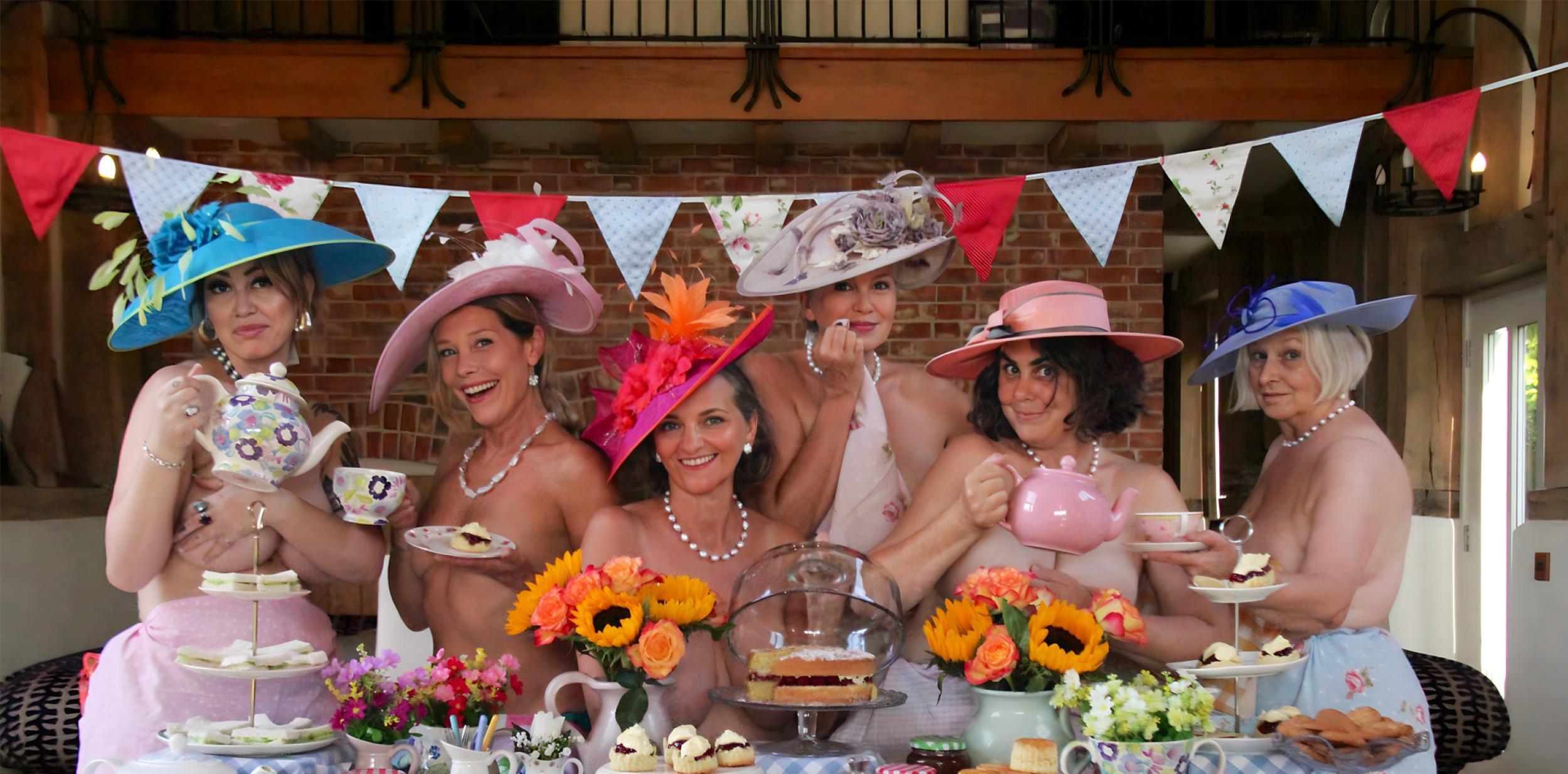 People standing topless at a tea party