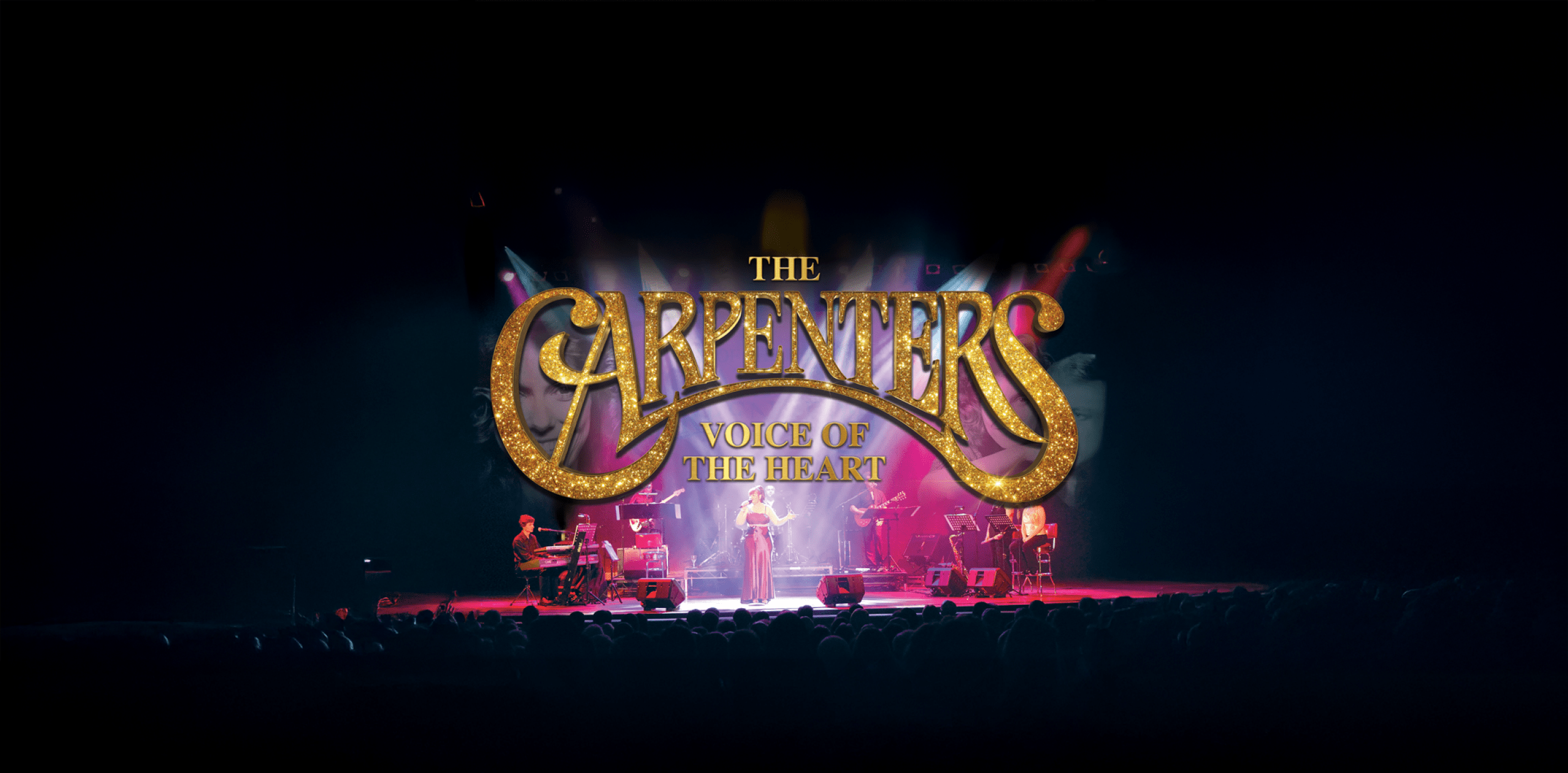 The Carpenters big title above a stage