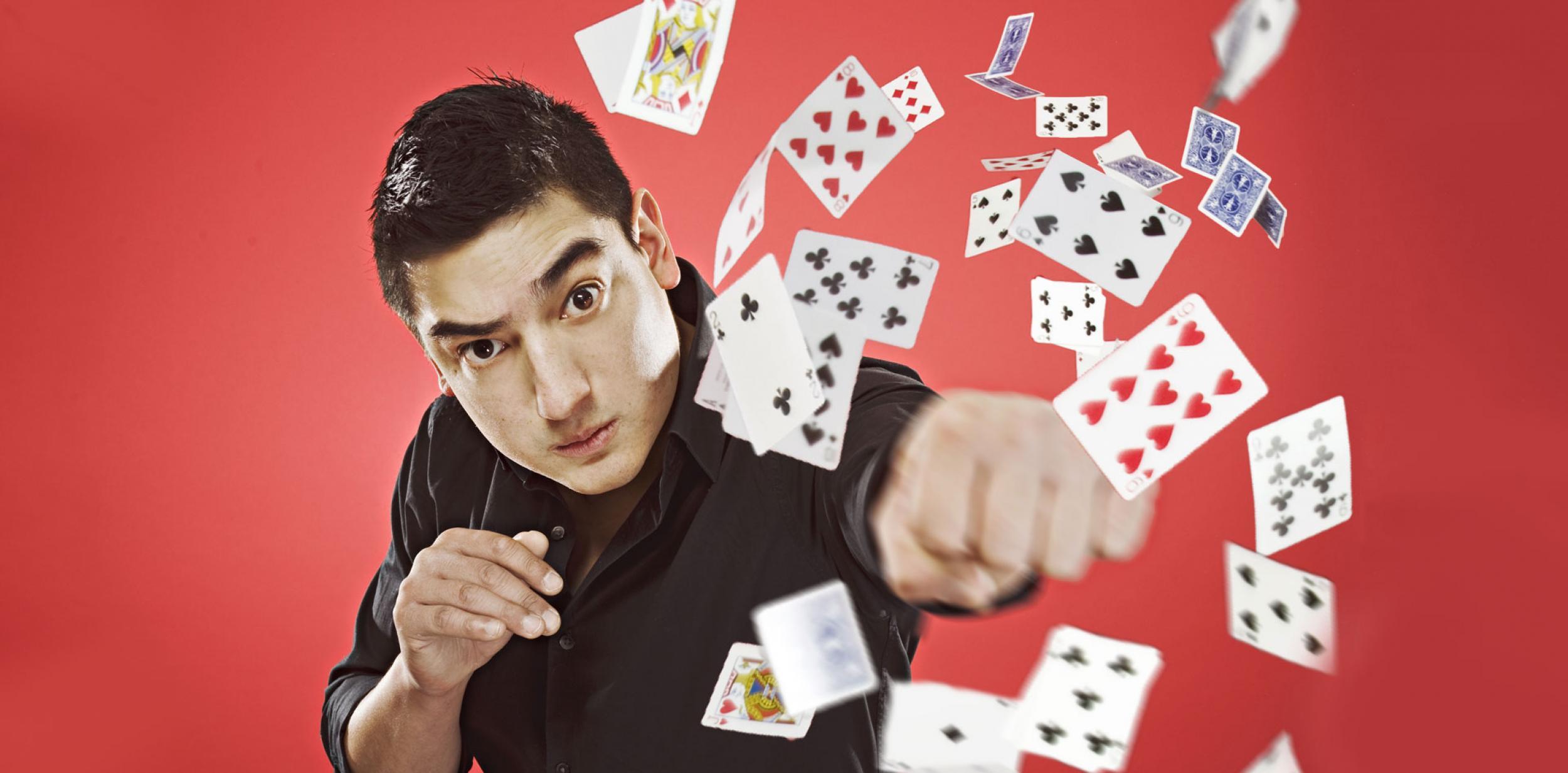 Javier Jarquin punching a pack of playing cards