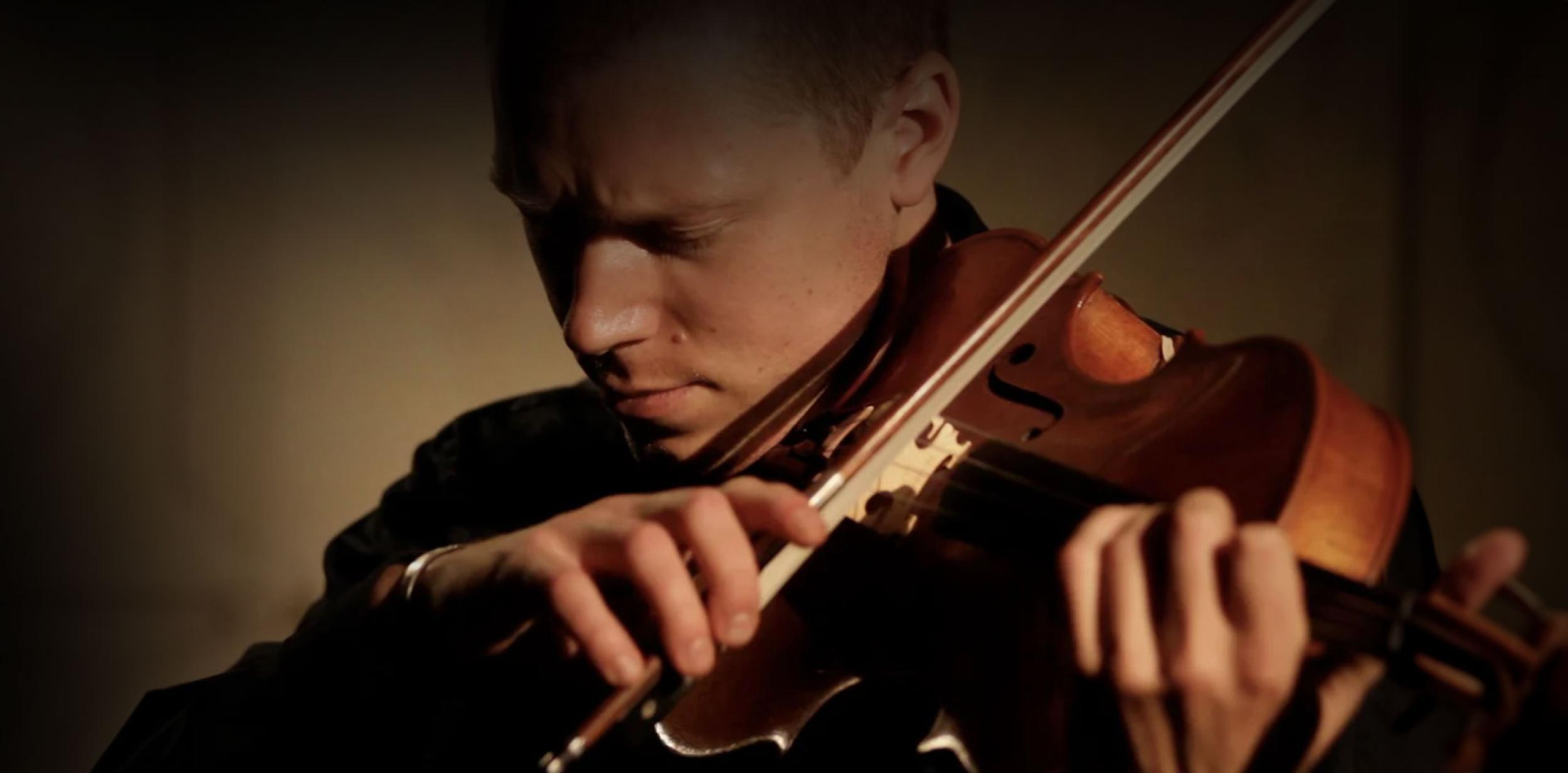 A person playing the violin