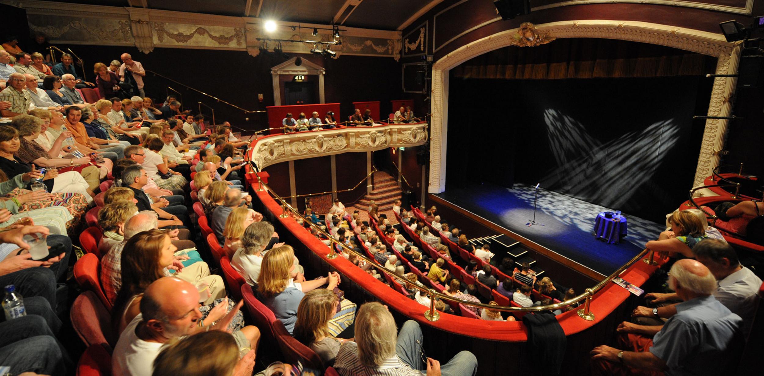 A full auditorium of people about to watch a show