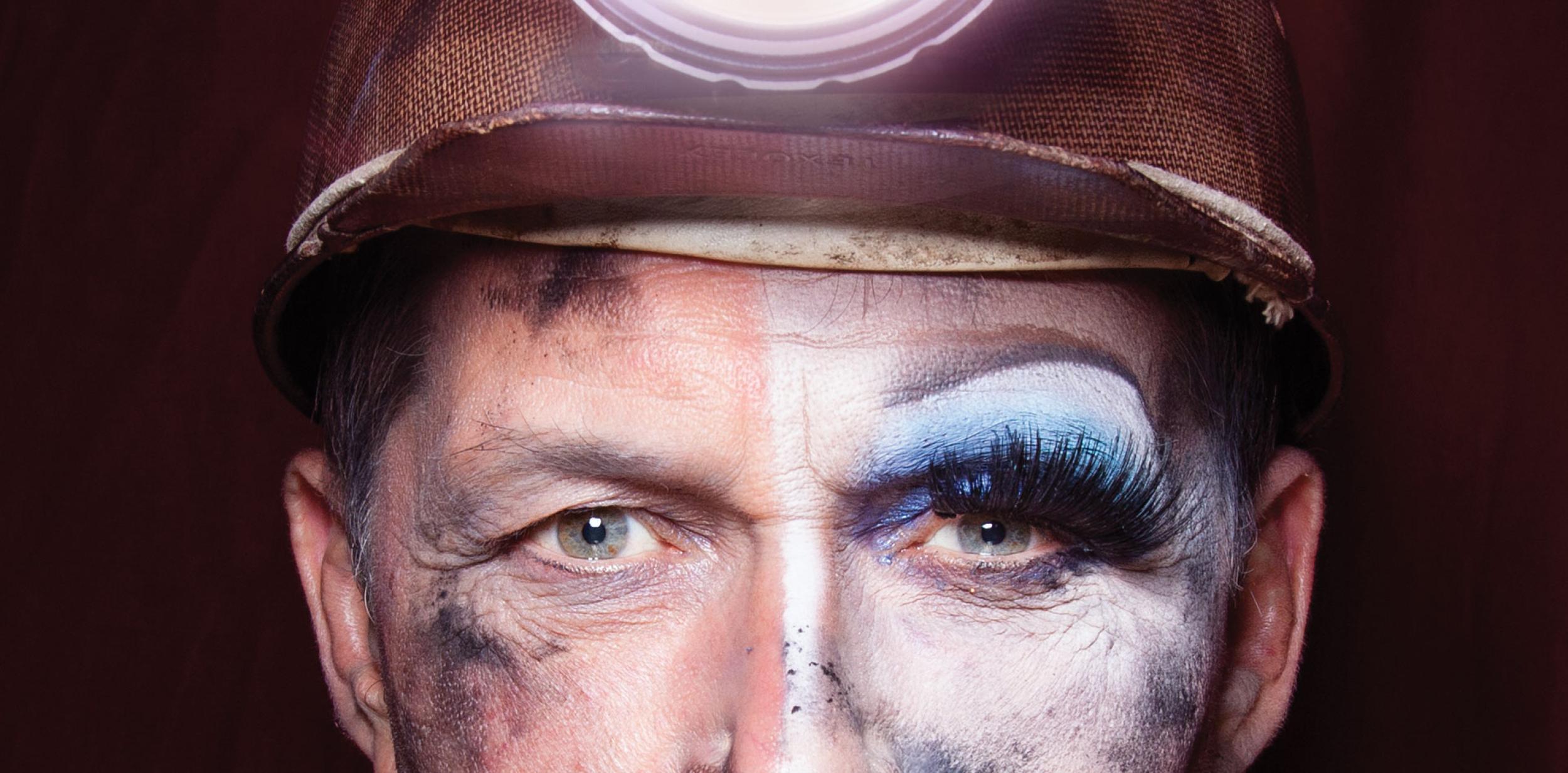 Coal miner with eye make-up