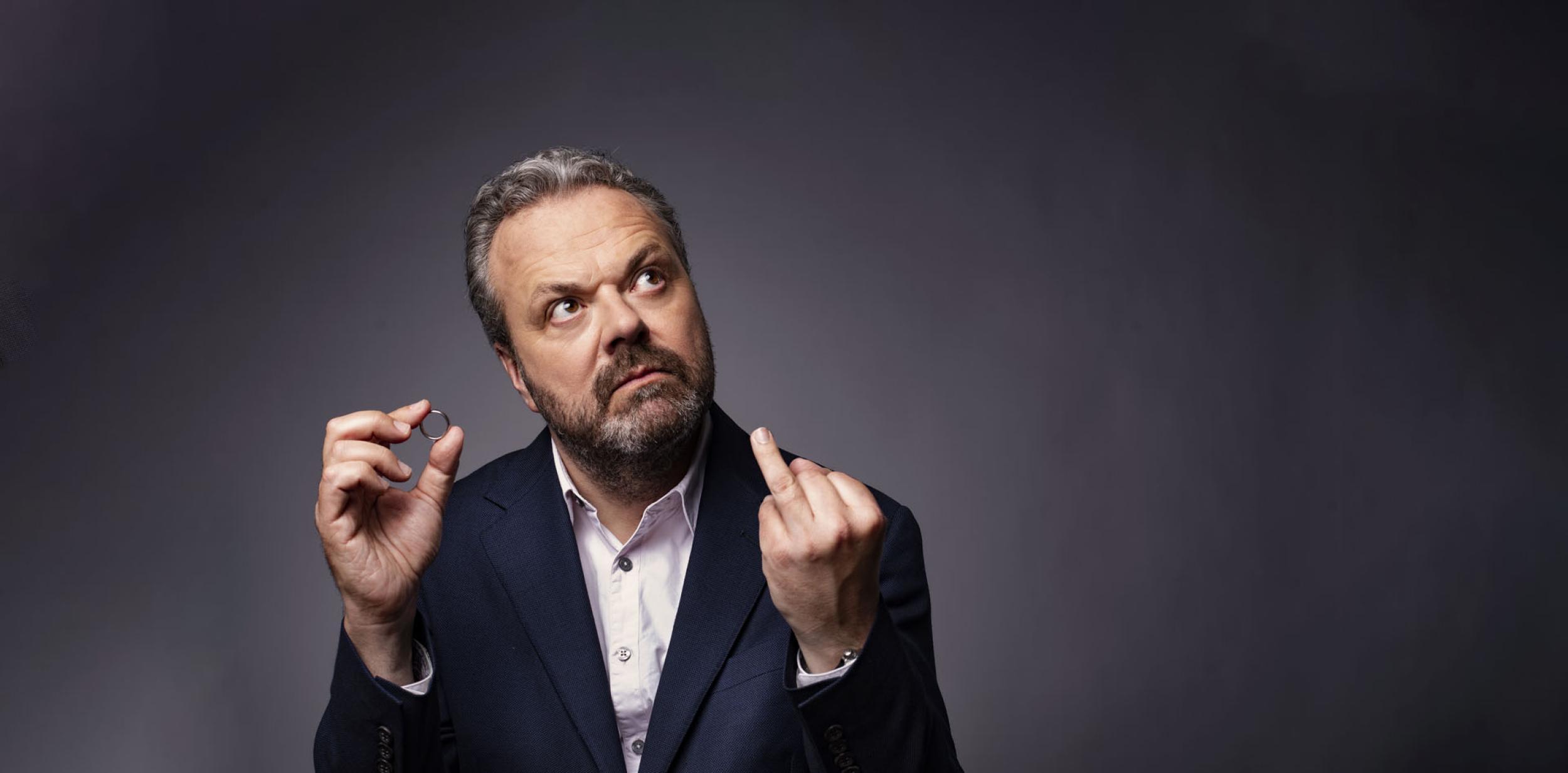 Hal Cruttenden with wedding ring and wedding finger extended