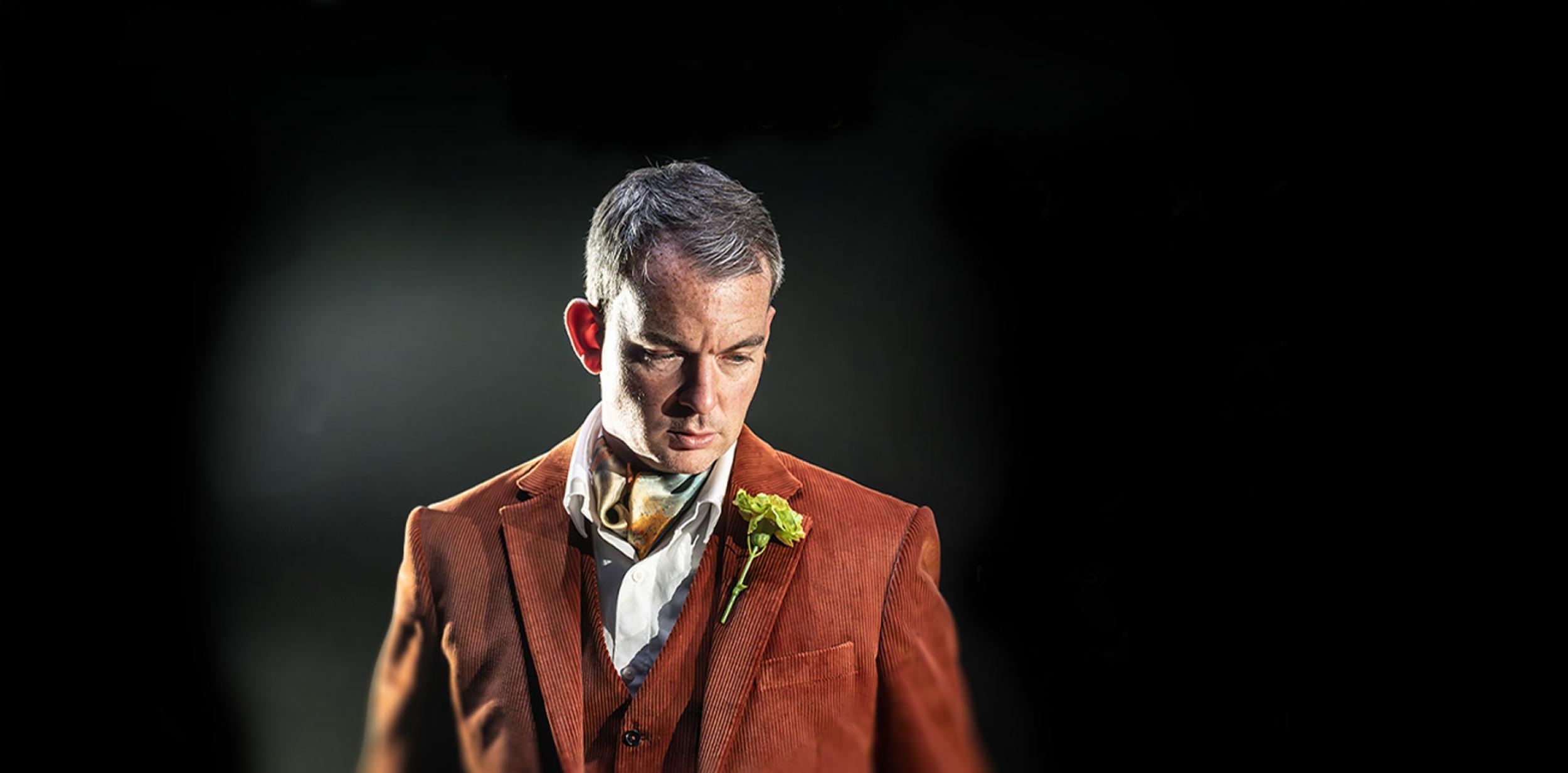 An Oscar Wilde character wearing a suit