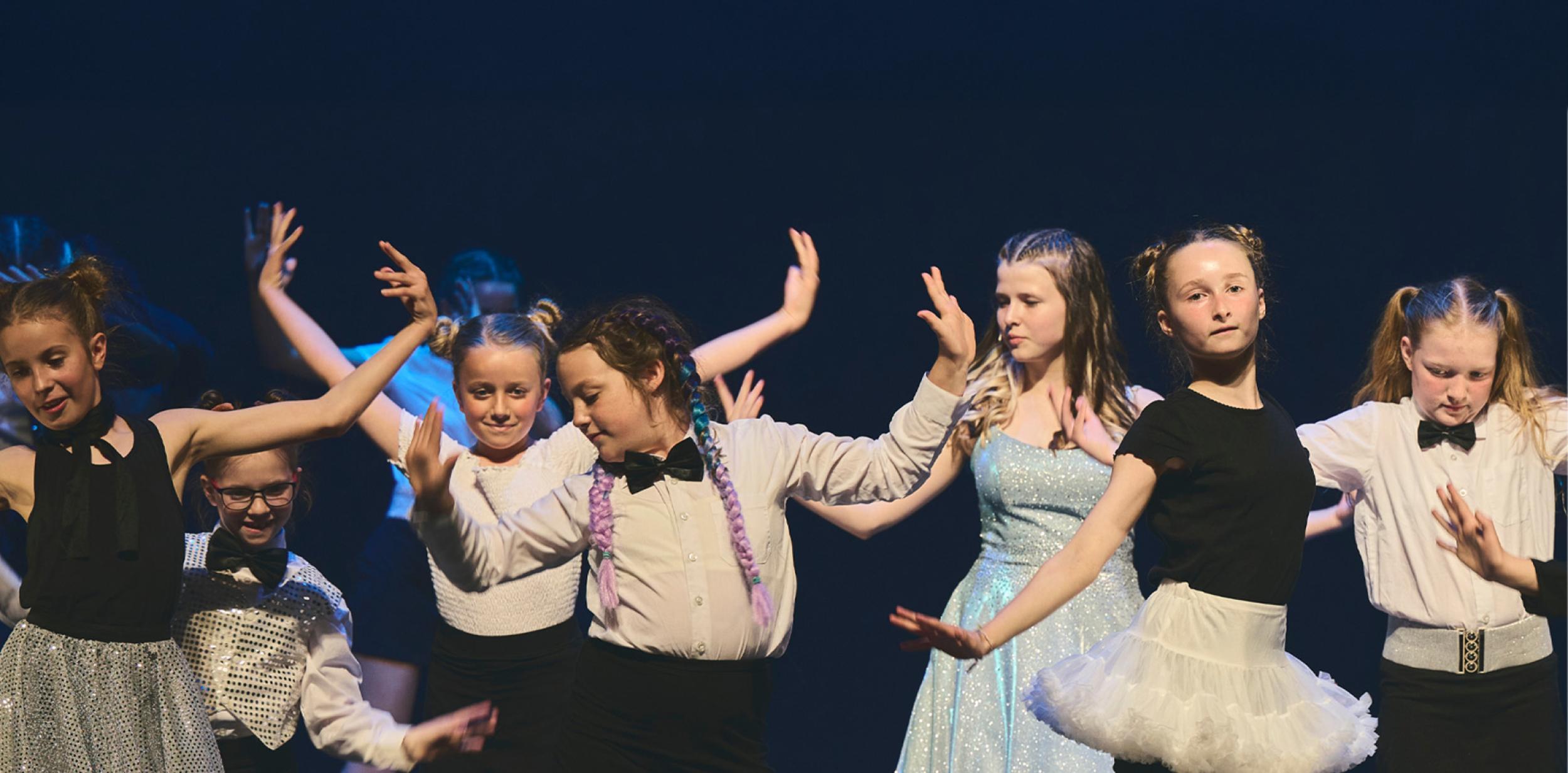 Young people dancing on stage