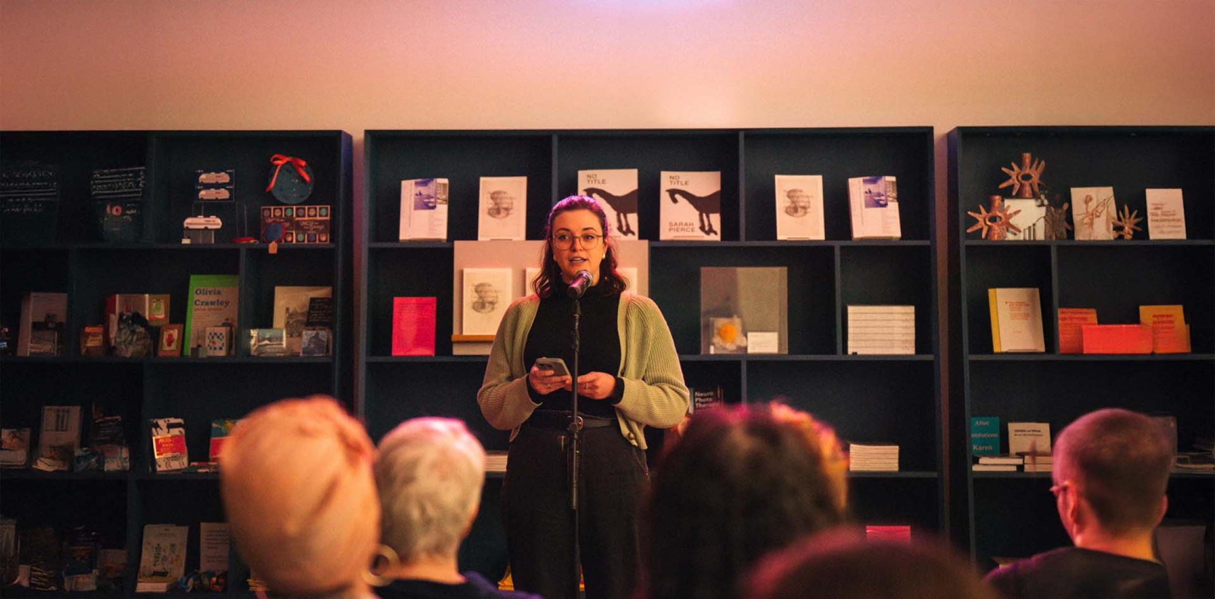 Jo Fisher performing spoken word in front of an audience