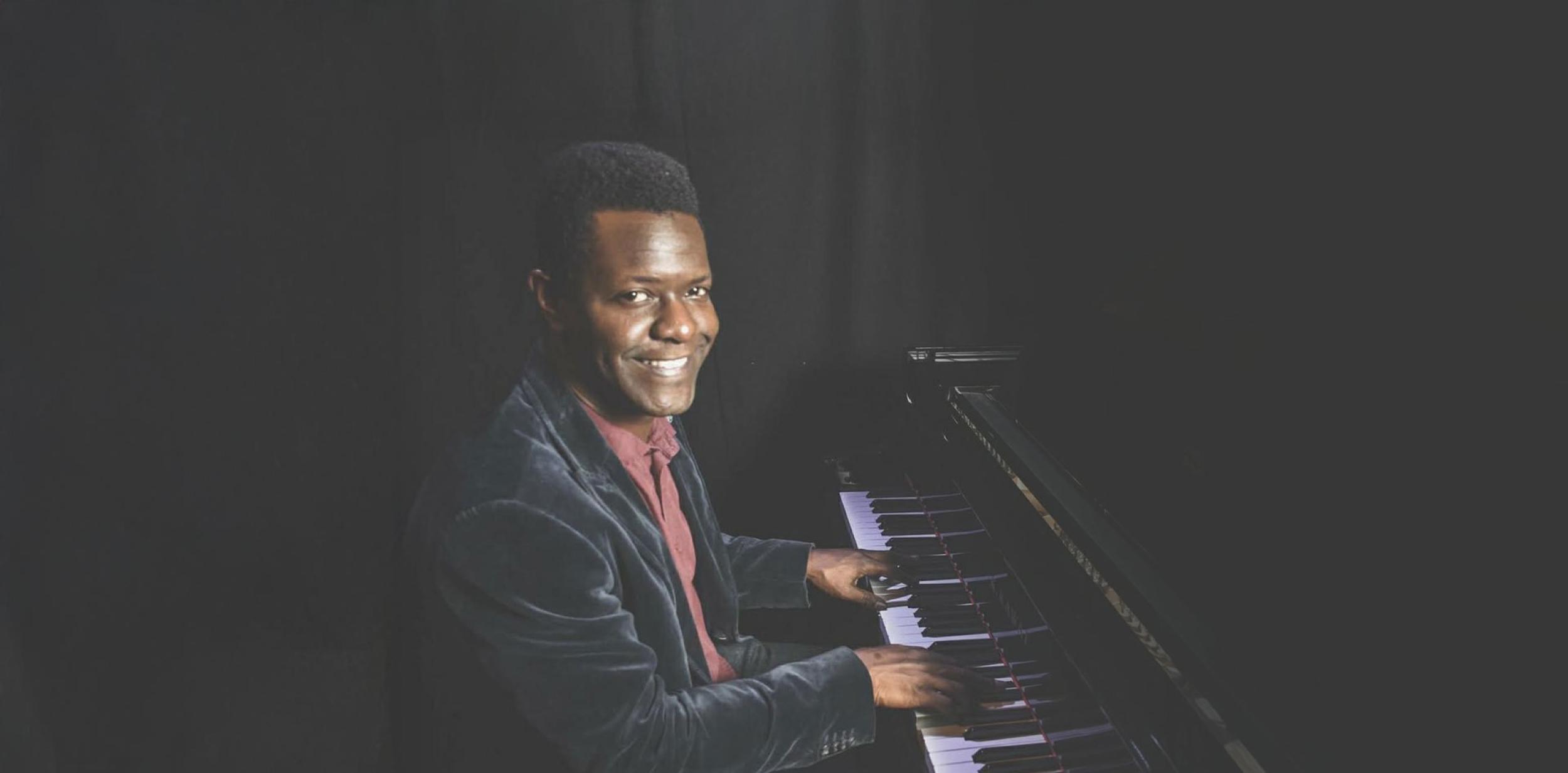 J Fashole-Luke playing a piano