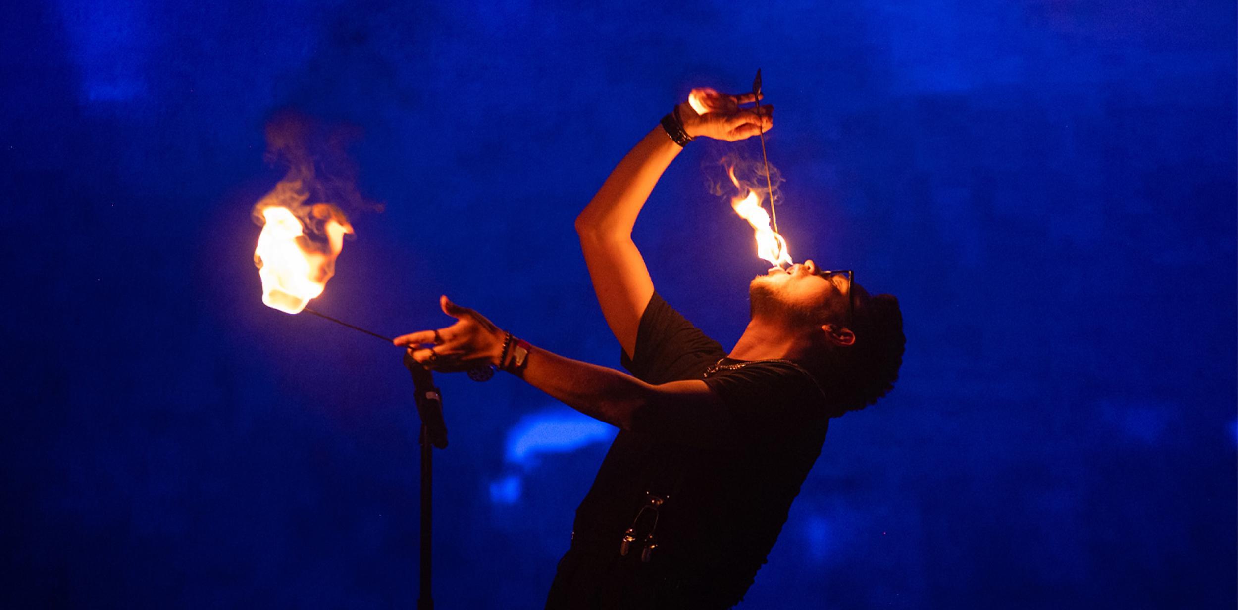 James Phelan performing a trick with fire.