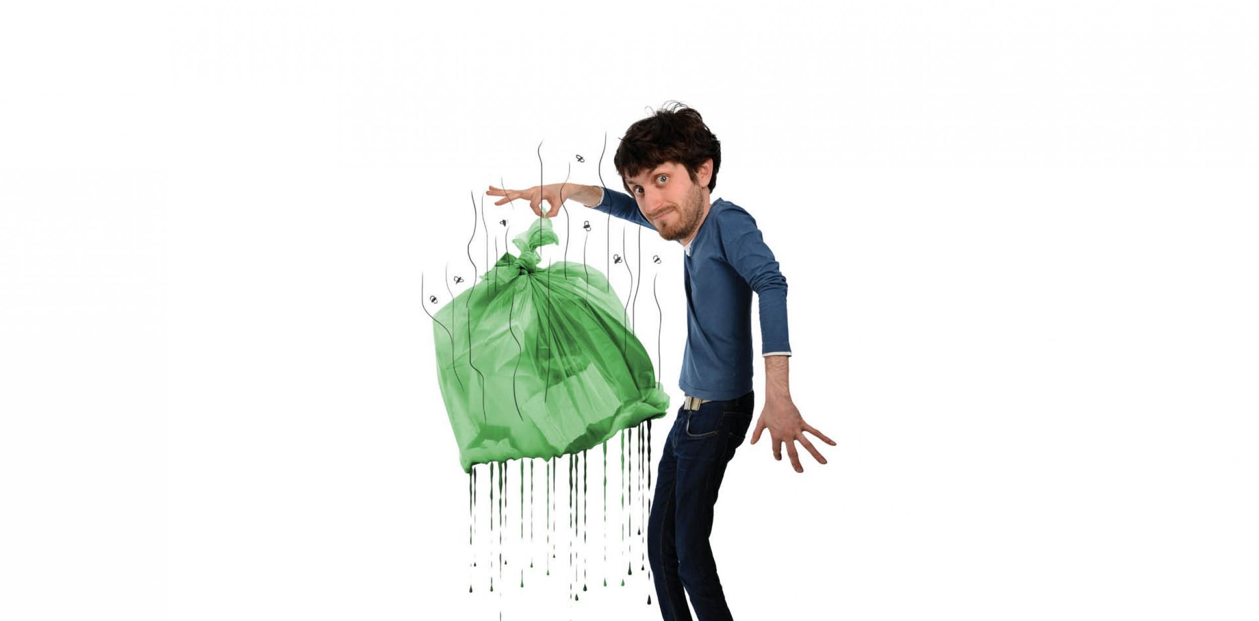 man holding a smelly rubbish bag