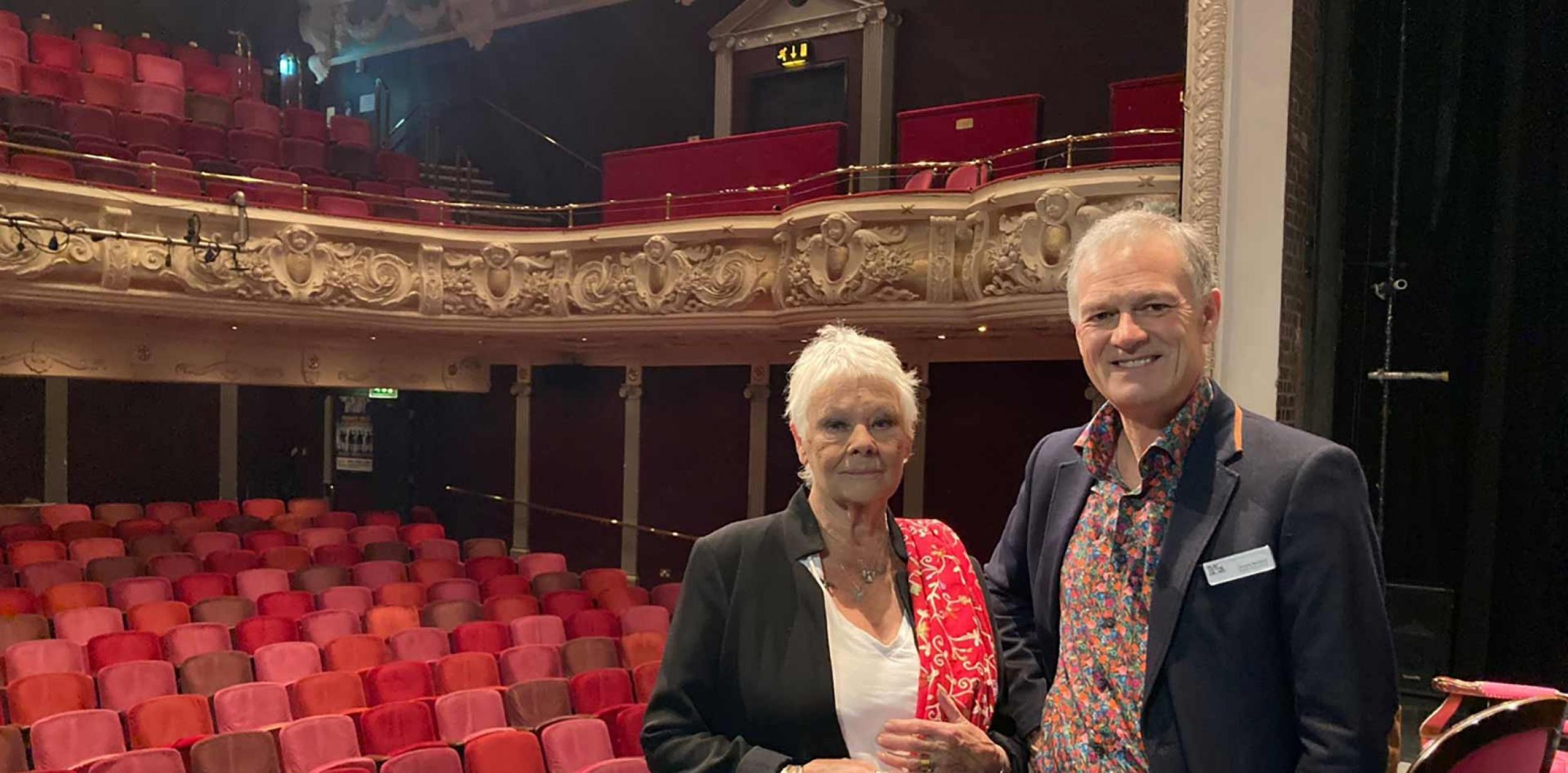 Judi Dench with Deryck Newland on stage at Theatre Royal Winchester