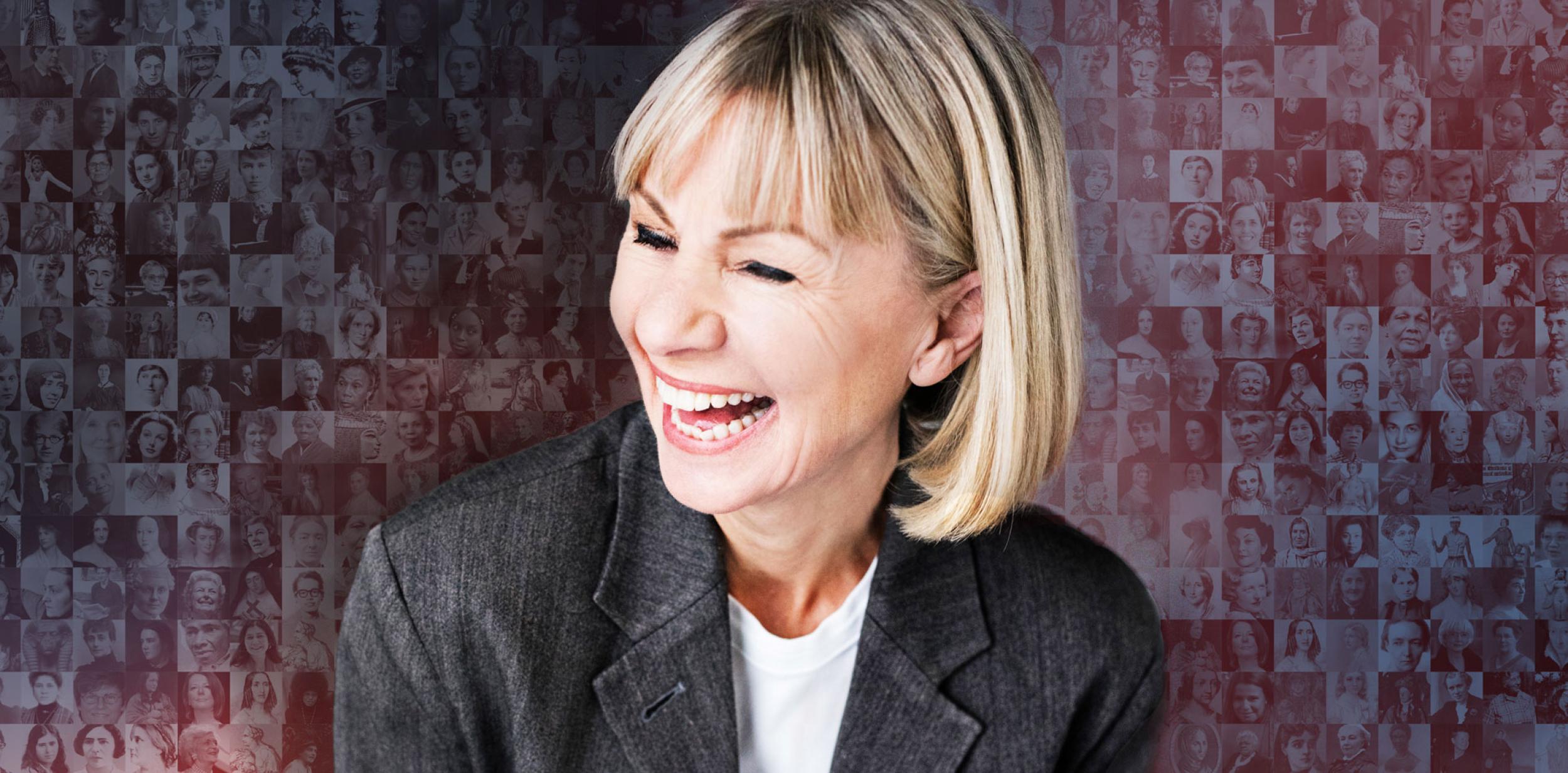 Kate Mosse laughing and looking to the side in front of lots of black and white photos of women
