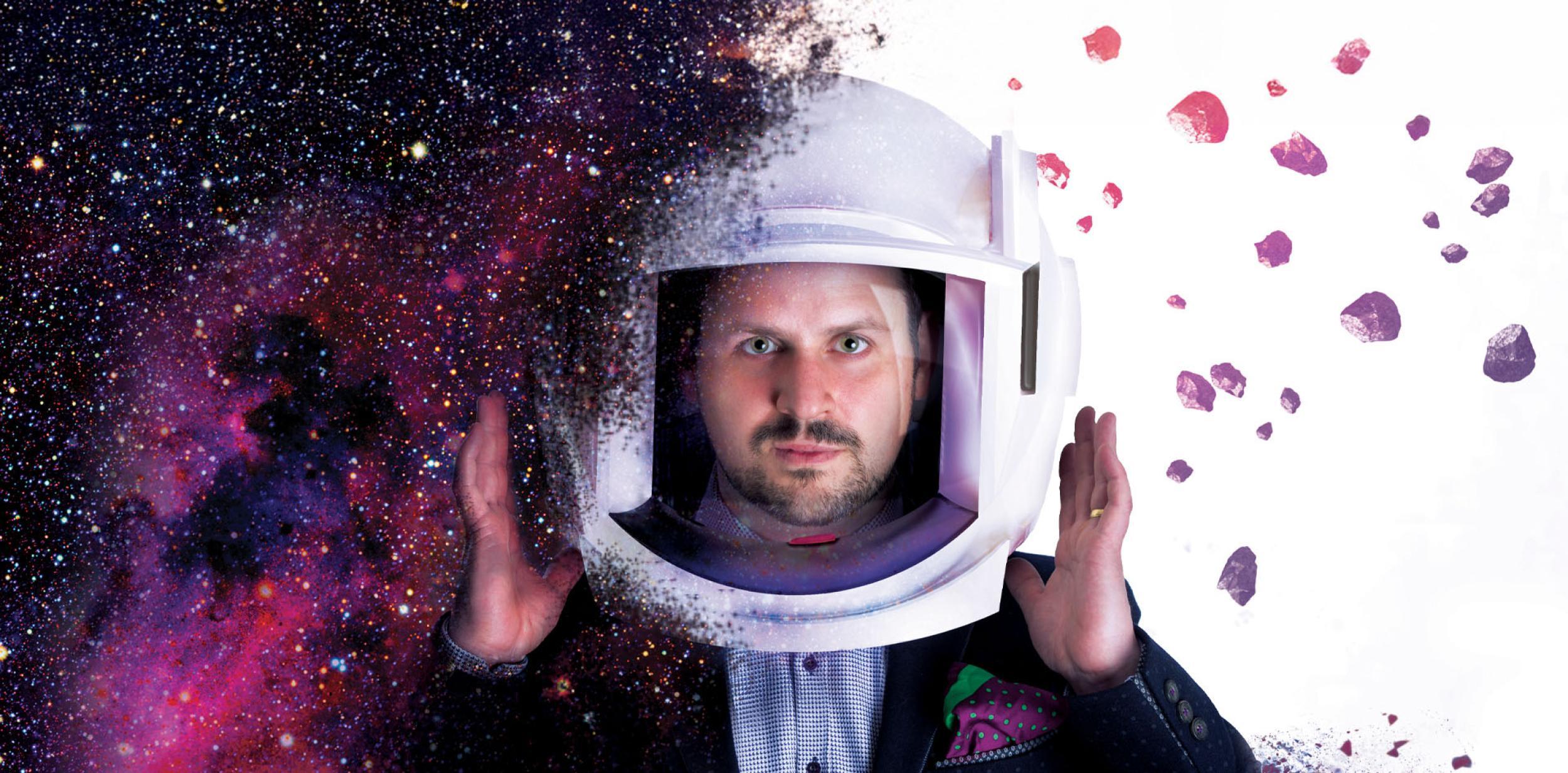 Kevin Quatum in a space suit surround by space-like matter.