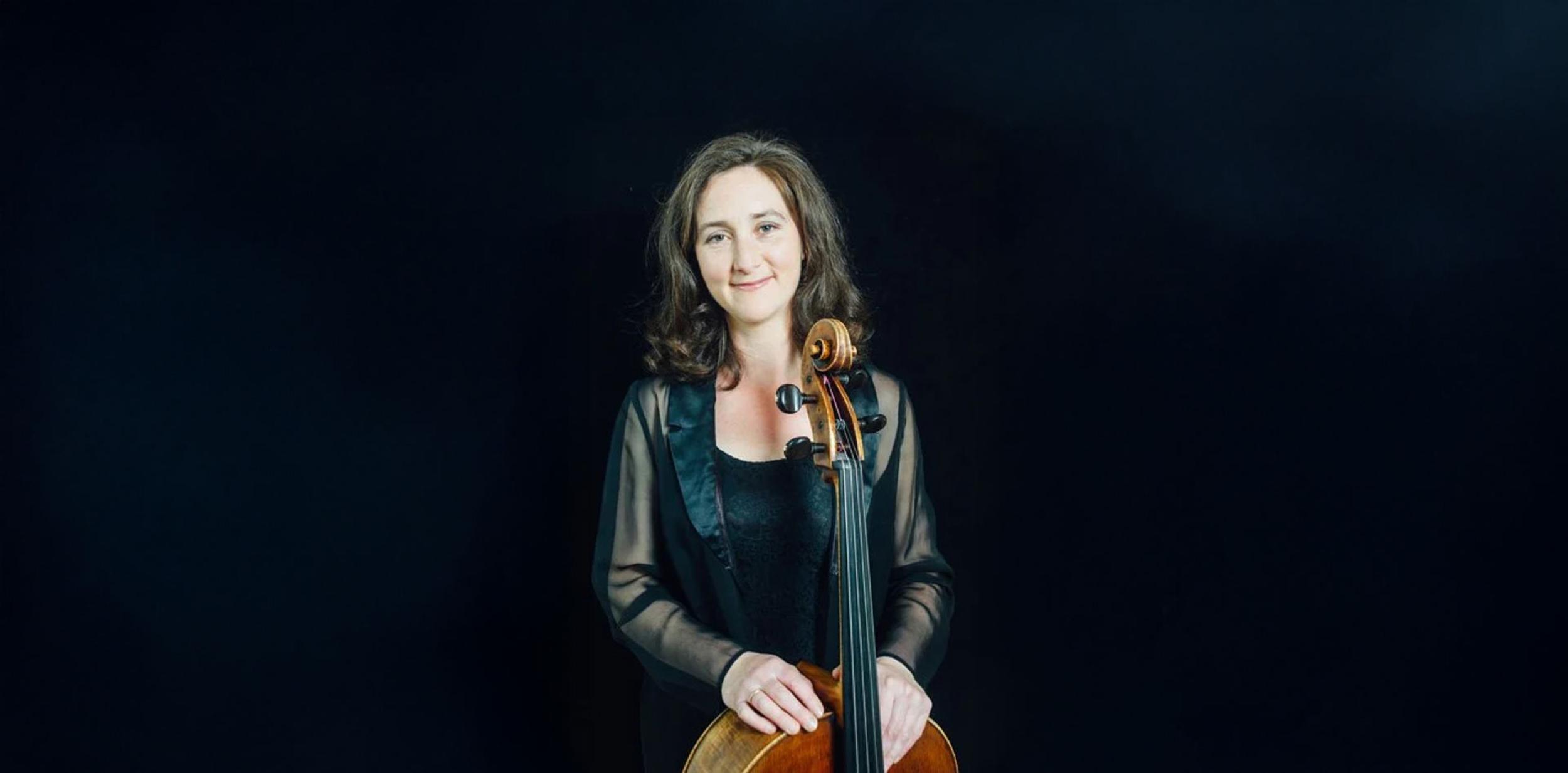 A person holding a cello