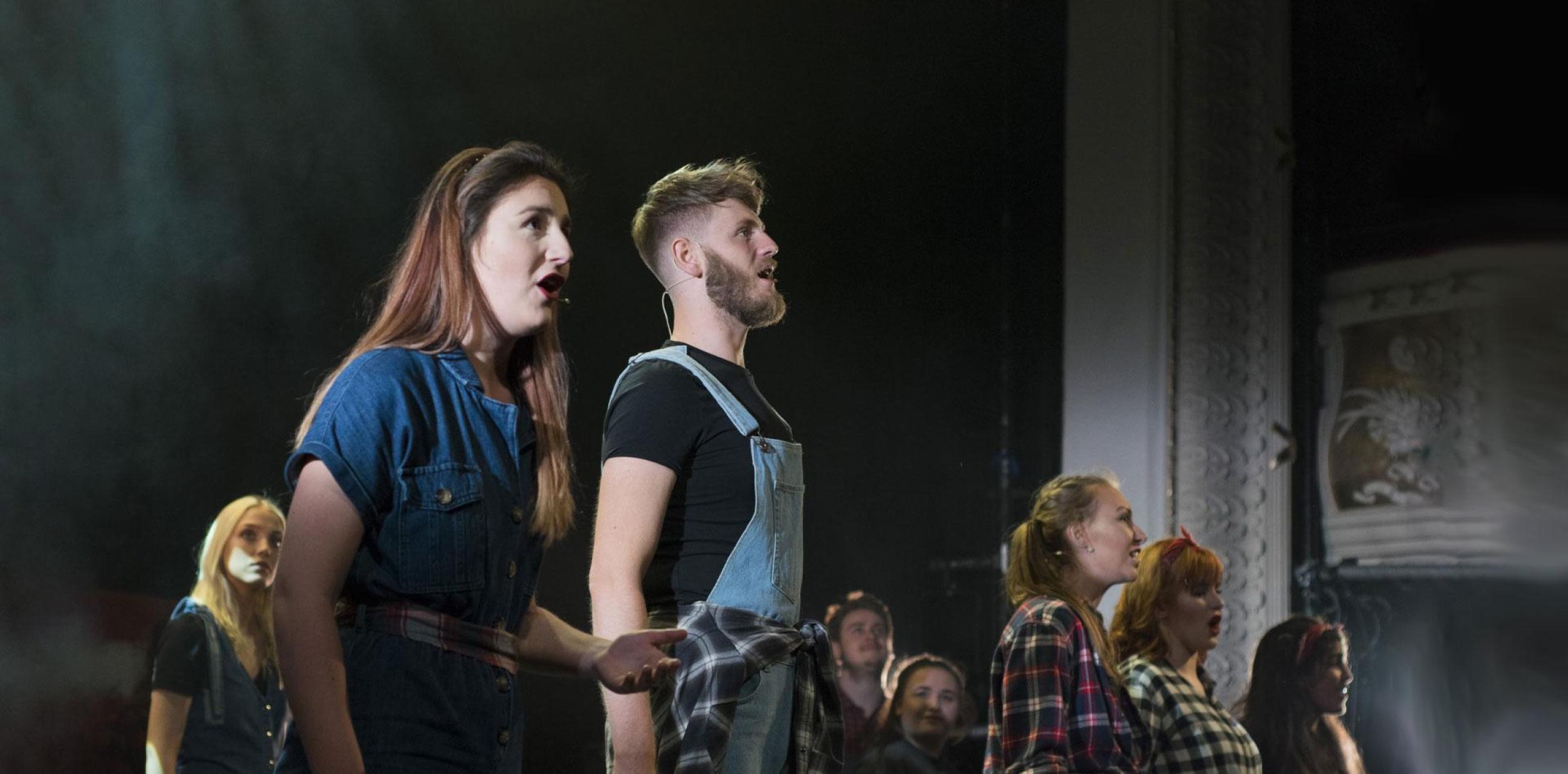 University students singing and performing