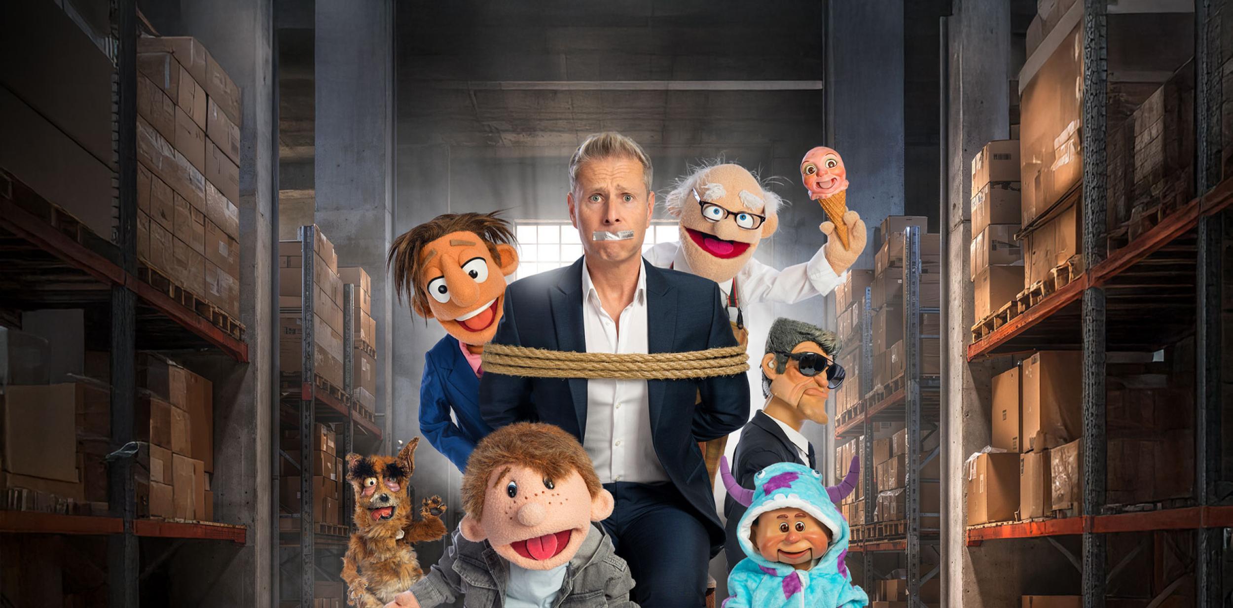 Paul Zerdin surrounded by puppets