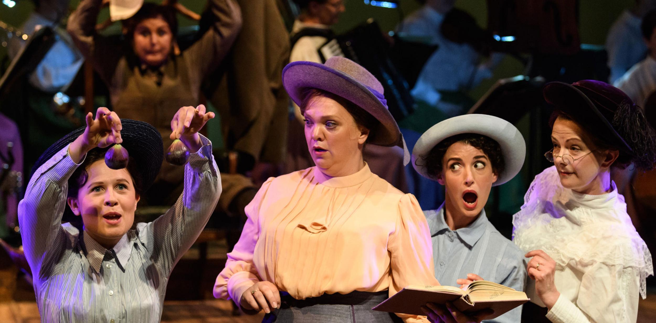 A group of women looking shocked and appalled 