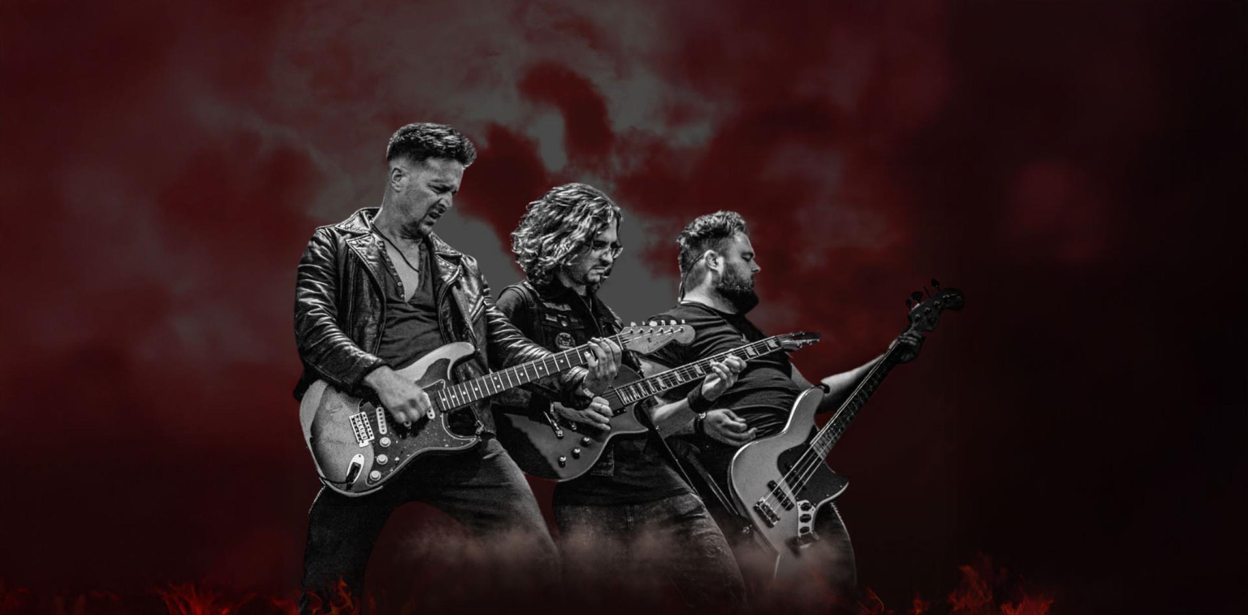 three people playing guitars