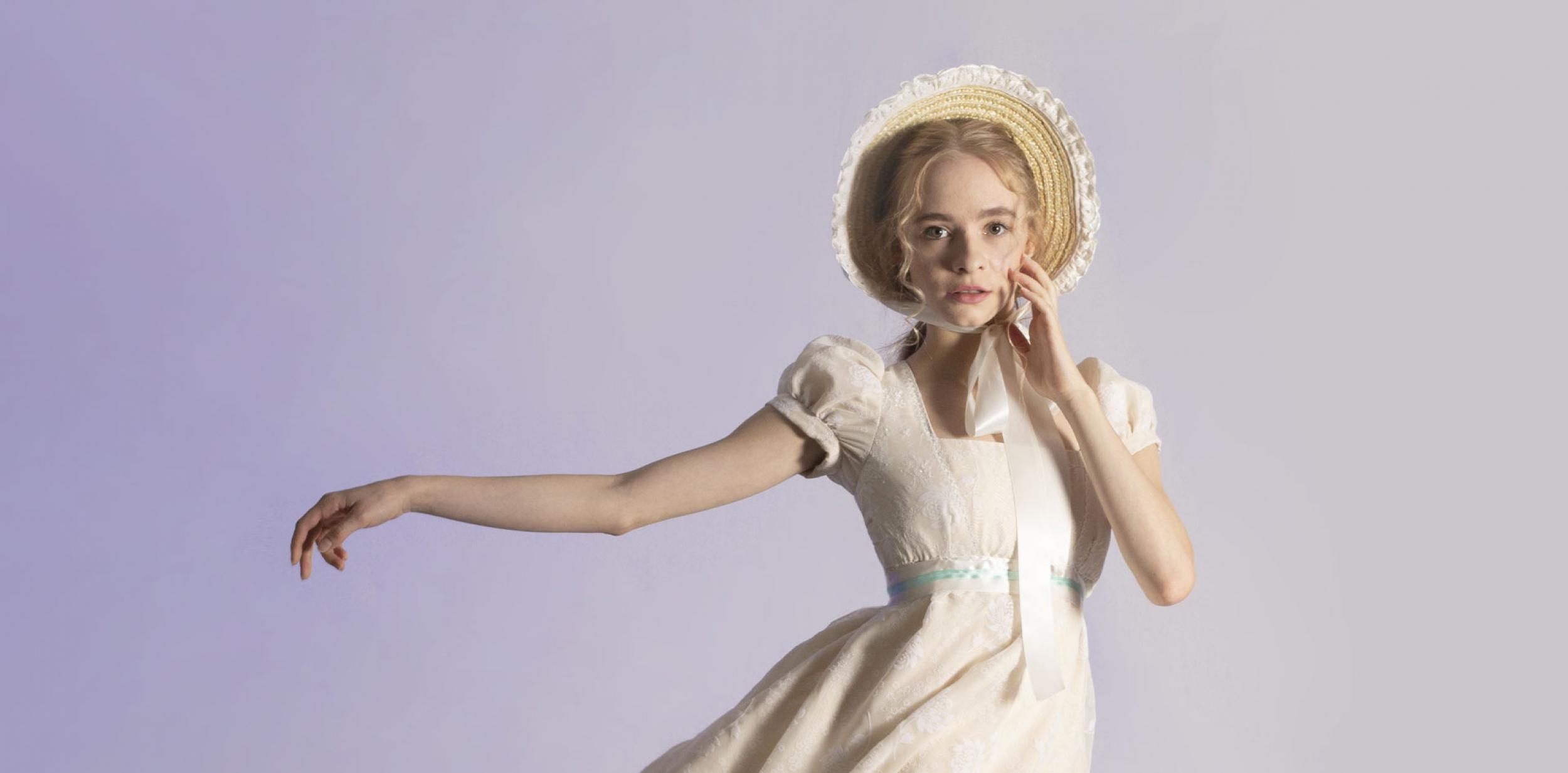 A ballet dancer in period drama costume.