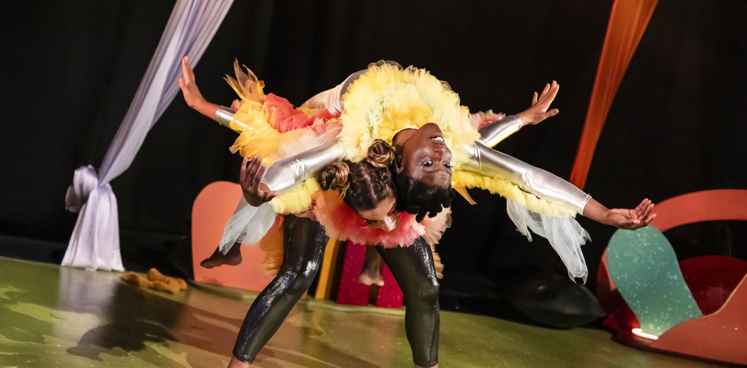 A person balancing on another person's back