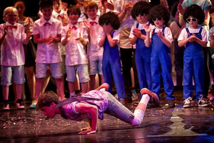 young boy break dancing