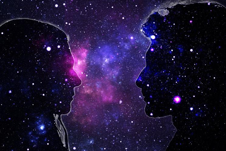 Two silhouettes of people facing each other, on a nebula background