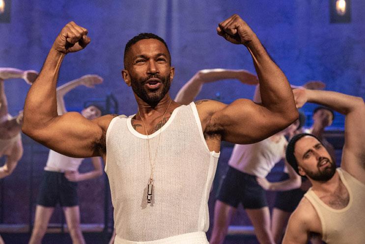 A person flexing their arm muscles