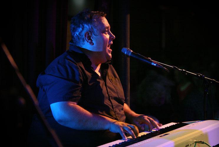A person playing an electric keyboard