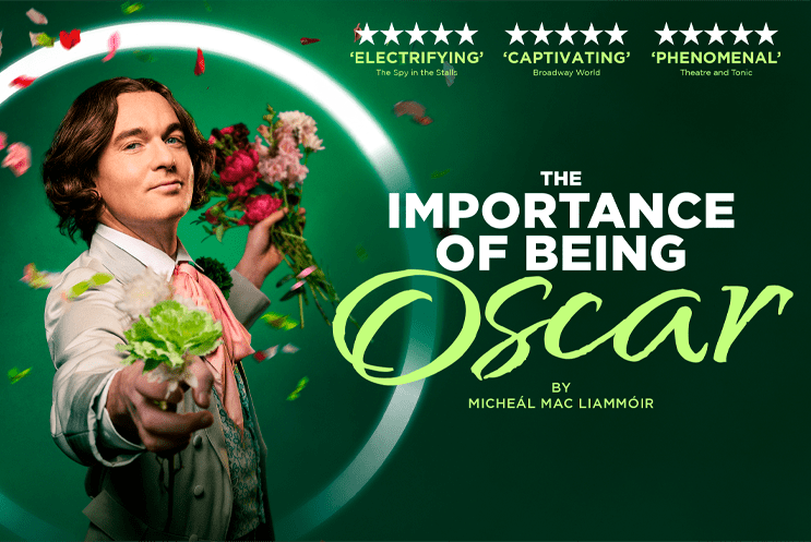 Oscar Wilde character holding out his hand and petals floating around him, with a green background and title treatment.