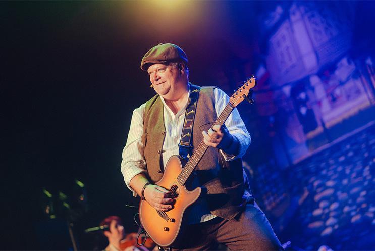 A musician playing a guitar.