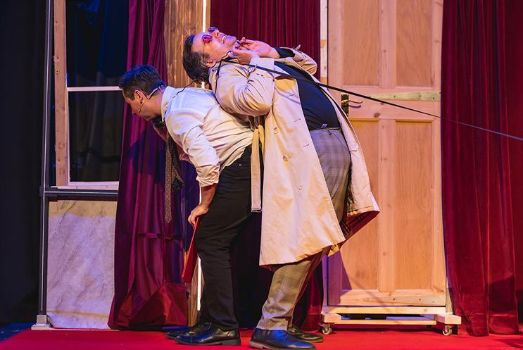 Two performers tangled in telephone wire