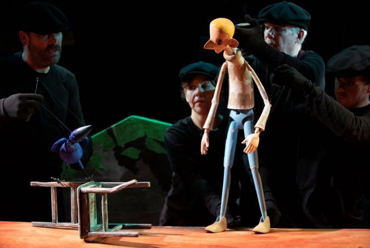 a male puppet on stage