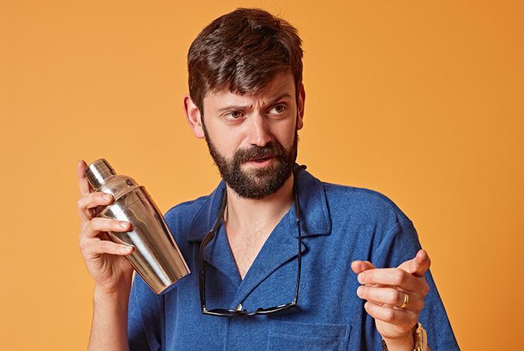 Fin Taylor with cocktail shaker pointing