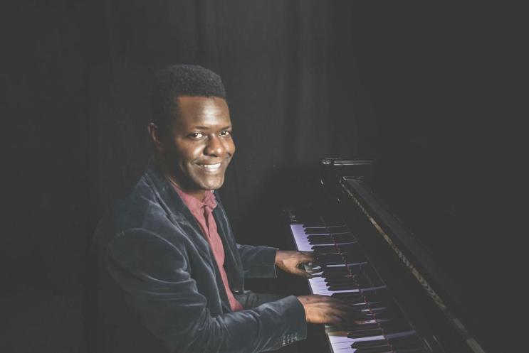 J Fashole-Luke playing a piano