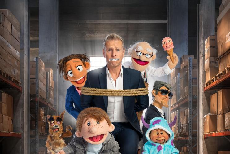 Paul Zerdin surrounded by puppets